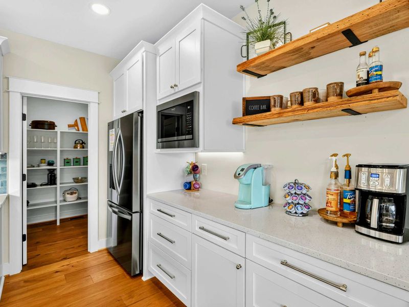 Coffee Bar -Every great getaway needs a coffee station! Featuring a Keurig & drip coffee maker,  syrups, stoneware mugs, rustic live-edge shelving - it's the perfect place to fuel up for the day. Our spacious walk-in pantry is just around the corner!