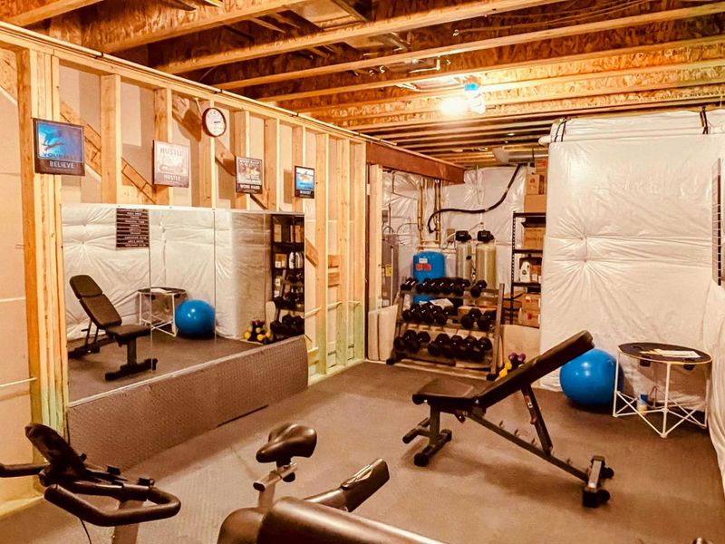 Our Fitness Room features a mirrored wall, adjustable bench, free weights from 5 to 50 lbs, and motivational décor—offering everything you need for a complete workout experience.