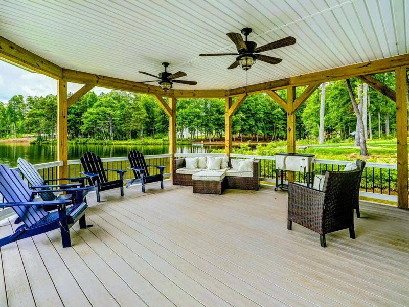 Amazing private dock and boat house with tiki bar, comfy lounge area for relaxing, and all the fun water toys!