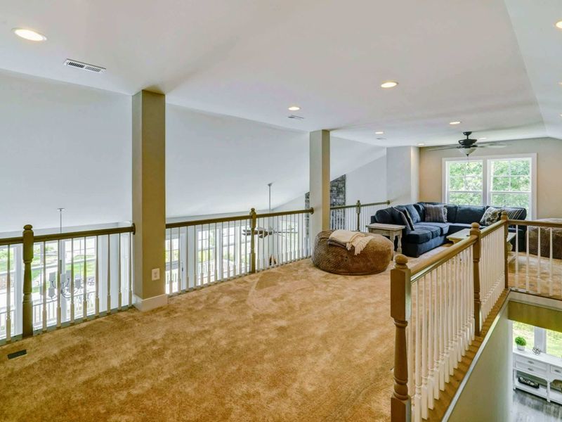 Upstairs loft (3rd living area) with TV and games.