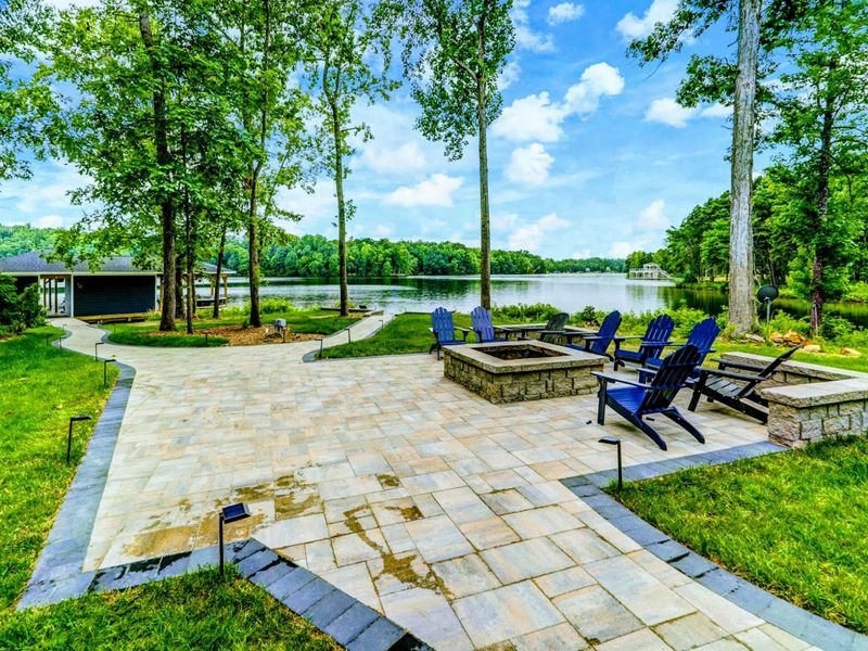 Two outdoor fire pits and a large furnished deck with outdoor dining options and gorgeous views of Lake Anna.