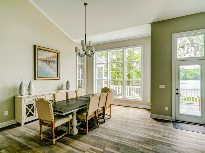 Dining area with a nice real wood table and comfortable seating for 8!