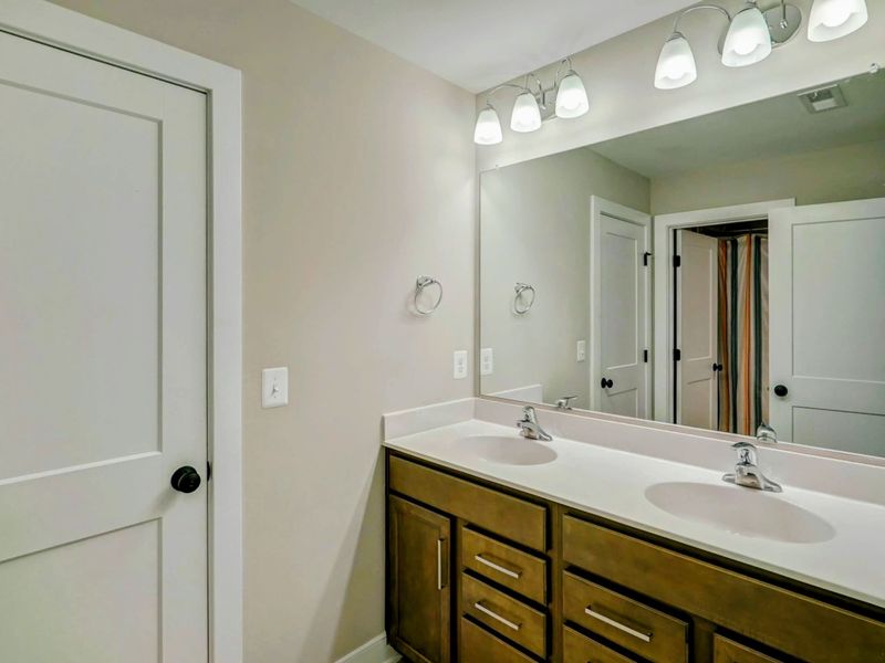 Upstairs bathroom with large double sink vanity and bath tub!