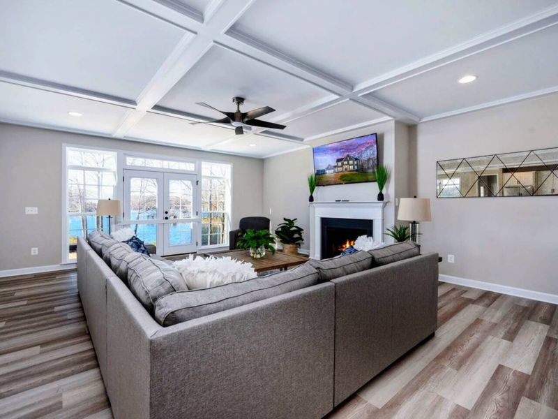 Great Room - Gas fireplace, big-screen TV above, and lake light pouring in: the room that pulls everyone in.