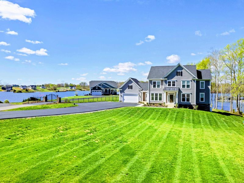 From the Lawn - Striped grass, plenty of room to park, and the lake on the left as you walk up to the front door.
