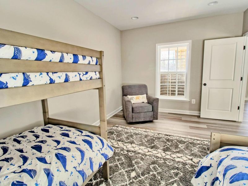 Bunk Room - Sleeps four with room to spare, plush rug for floor time, and an easy walk to the lower-level bath.