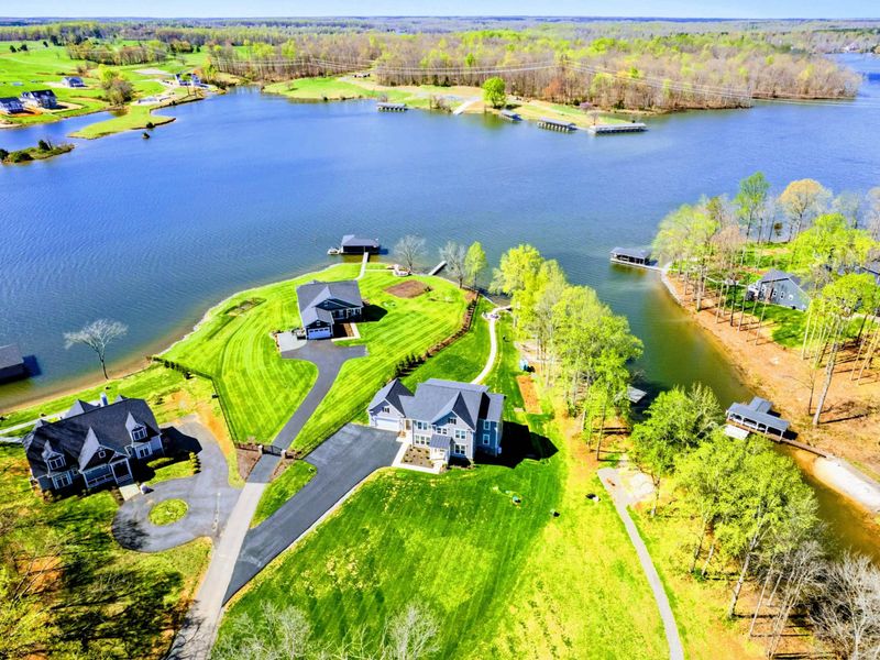 From Above - The property sitting out on its own point, water on three sides, the kind of frontage most homes only dream about.