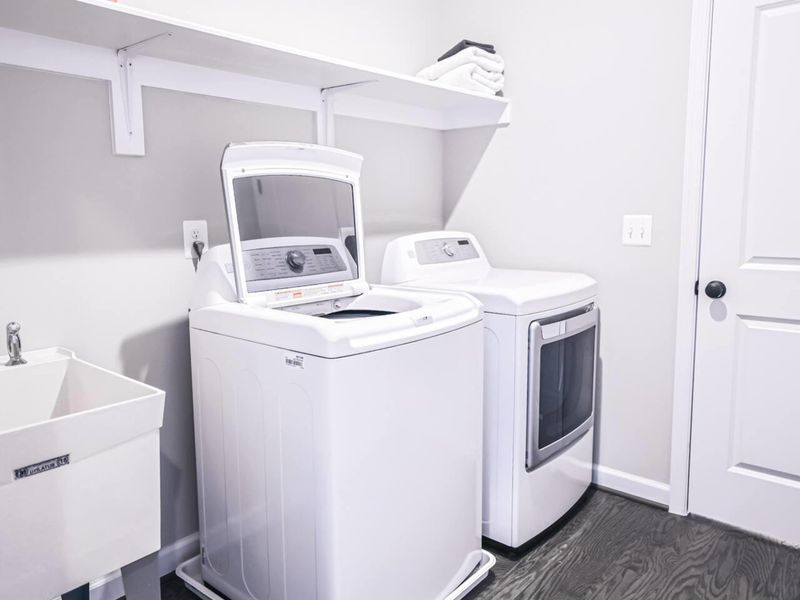 Laundry Room - Full-size washer and dryer plus a utility sink, ideal for rinsing off after a long day on the water.