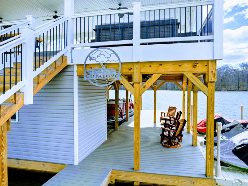 Your family will enjoy our large private lakefront lot with ~300' of waterfront property, a private sandy beach, amazing private 2 story dock and boat house with large comfy lounge area for re