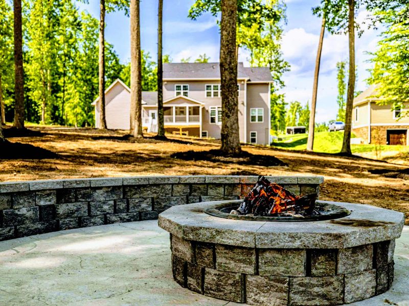 Relax and toast marshmallows around the outdoor fire pit, offering a cozy spot for evening chats and serene lake views!