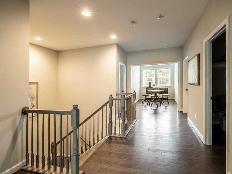 Navigate with ease through our home's upper level, featuring a welcoming hallway