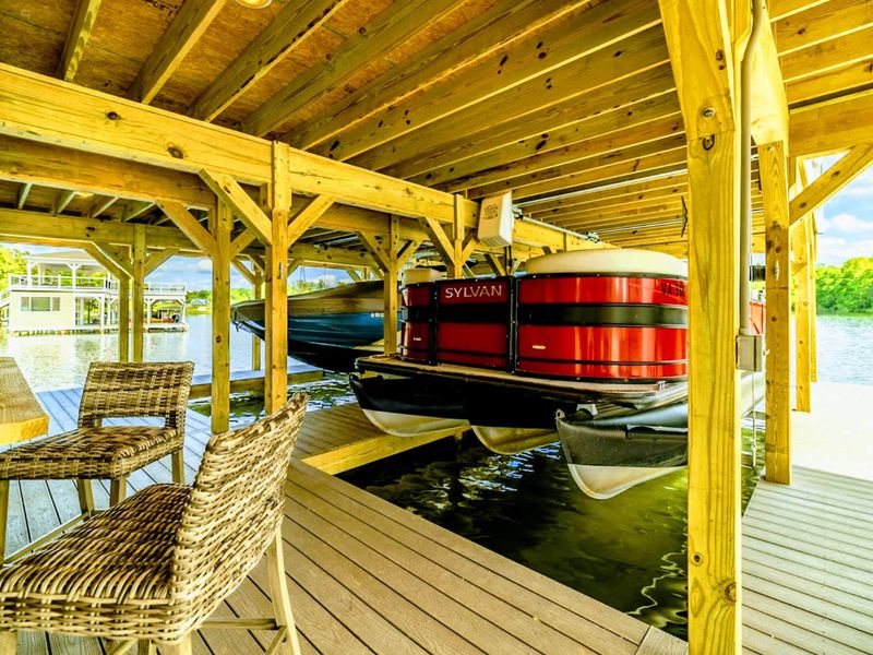 Unwind by the water on your private boat dock, perfect for enjoying serene lake views and easy access to aquatic adventures