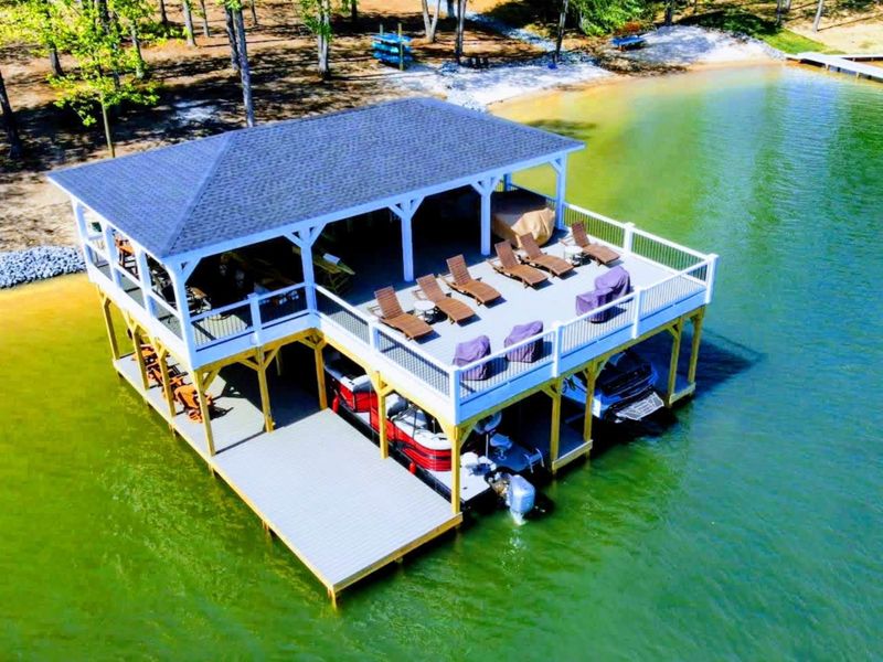 Your family will enjoy our large private lakefront lot with ~300' of waterfront property, a private sandy beach, amazing private 2 story dock and boat house with large comfy lounge area for re