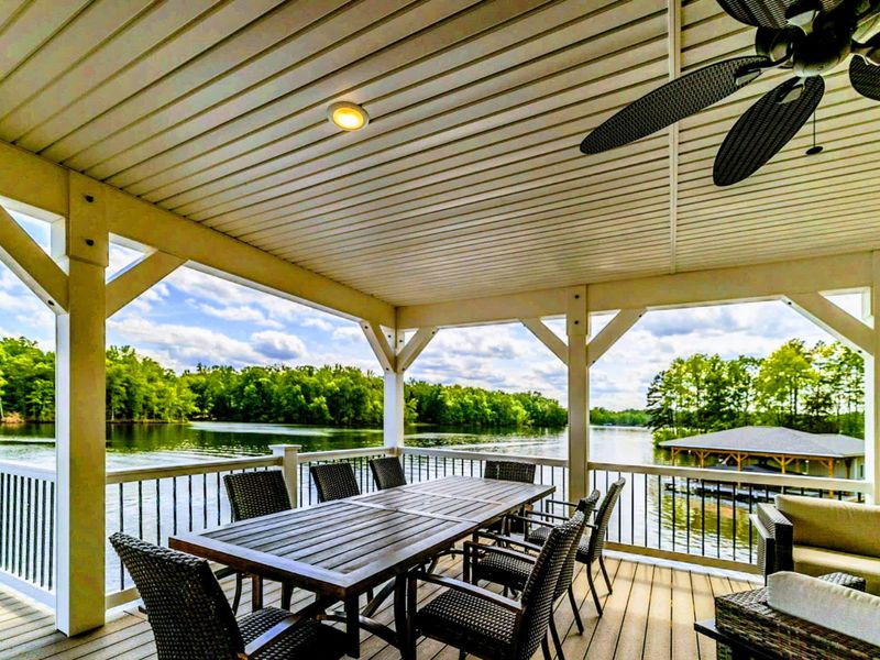 Delight in alfresco dining or simply unwind on our covered deck with comfortable seating and breathtaking views of the lake