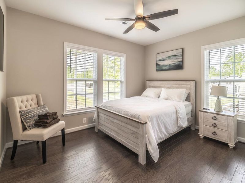 Sleep in style in this tranquil bedroom that boasts a comfortable bed, tasteful decor, and an en-suite bathroom for your privacy and convenience