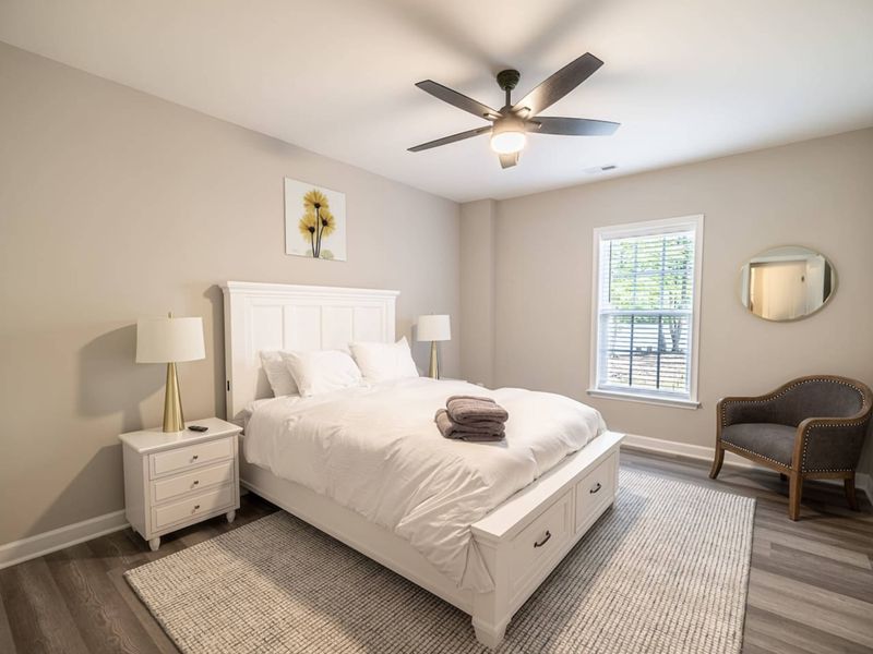 Relax in this bright and cozy bedroom with a plush queen-size bed, chic decor, and all the comforts needed for a peaceful stay