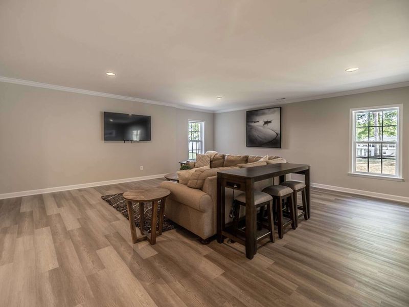 Enjoy the comfort and style of our spacious Basement area, which features plush seating, a large 4K TV perfect for family gatherings (Shuffleboard table was added after picture was taken)!