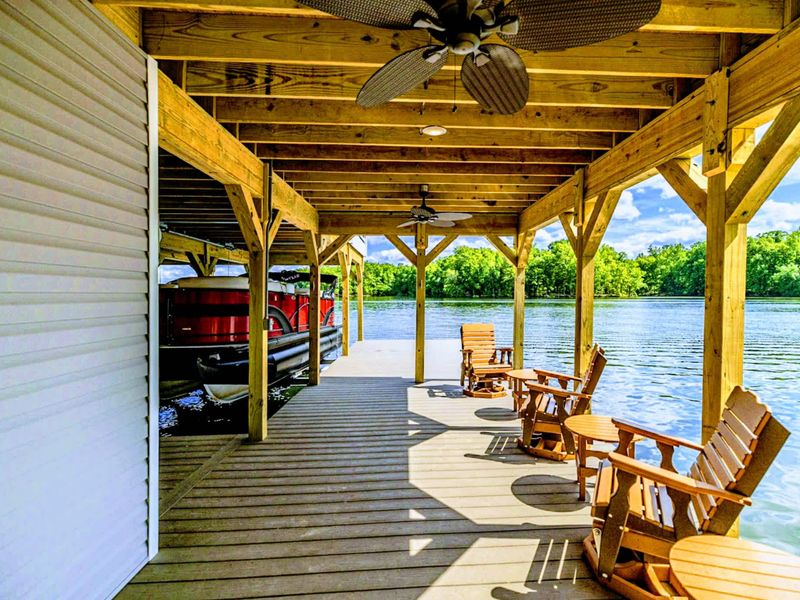 Enjoy the luxury of a private boat dock and tranquil seating area, perfect for lakeside relaxation and recreation
