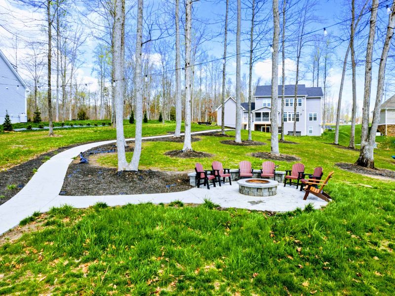 Relax and toast marshmallows around the outdoor fire pit, offering a cozy spot for evening chats and serene lake views!