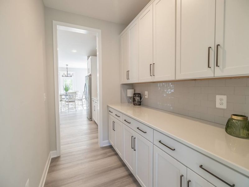Our butler pantry offers guests a dedicated space for meal preparation and storage away from the main kitchen area!