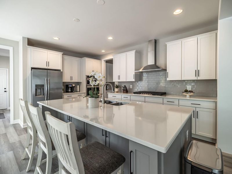 Whip up delicious meals in our fully equipped, modern kitchen with spacious countertops, state-of-the-art new stainless steel appliances, and a welcoming breakfast bar!