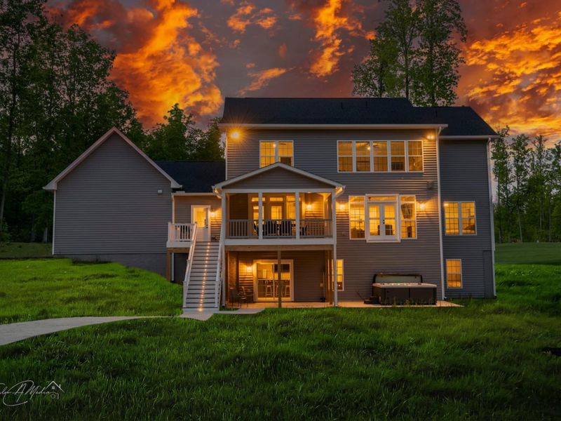 Experience the warmth and charm of our lakeside retreat, bathed in the glow of a breathtaking sunset!