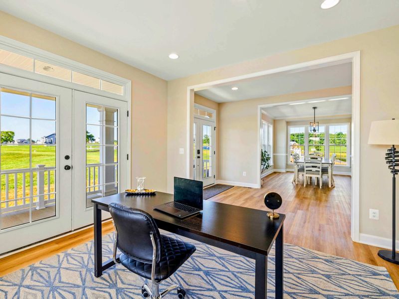 Modern home office with direct access to a dining area and outdoor views