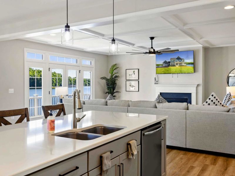 Our open-concept kitchen and living area offer a perfect blend of modern amenities and cozy comfort, with stunning lake views.