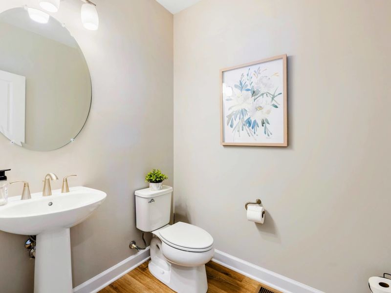 Charming half-bath with modern fixtures and stylish decor