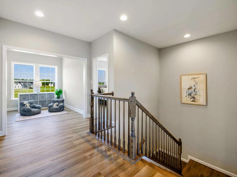 Bright and cozy loft area with comfortable seating and scenic window views