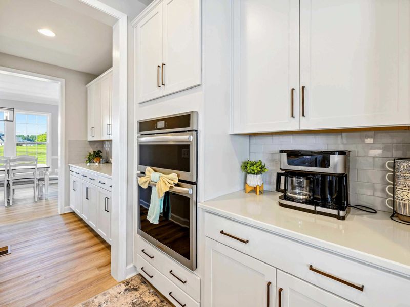 Charming and functional kitchen nook with modern appliances and ample storage space
