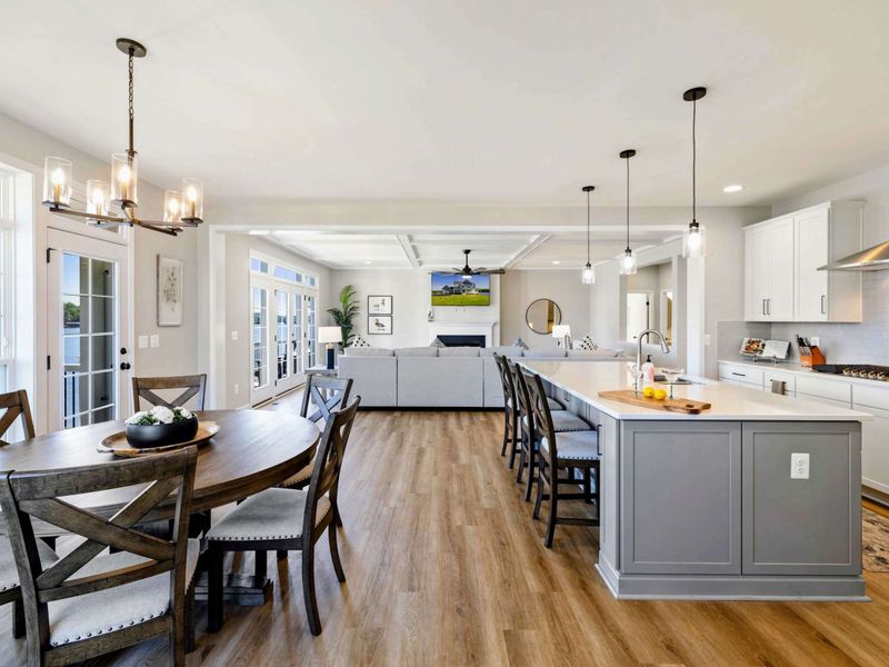 Spacious and modern open-concept living area with a fully equipped kitchen, dining space, and comfortable seating for relaxation.