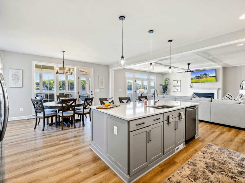 Our open-concept layout seamlessly connects the kitchen, dining, and living areas, creating a spacious and inviting environment with beautiful lake views.