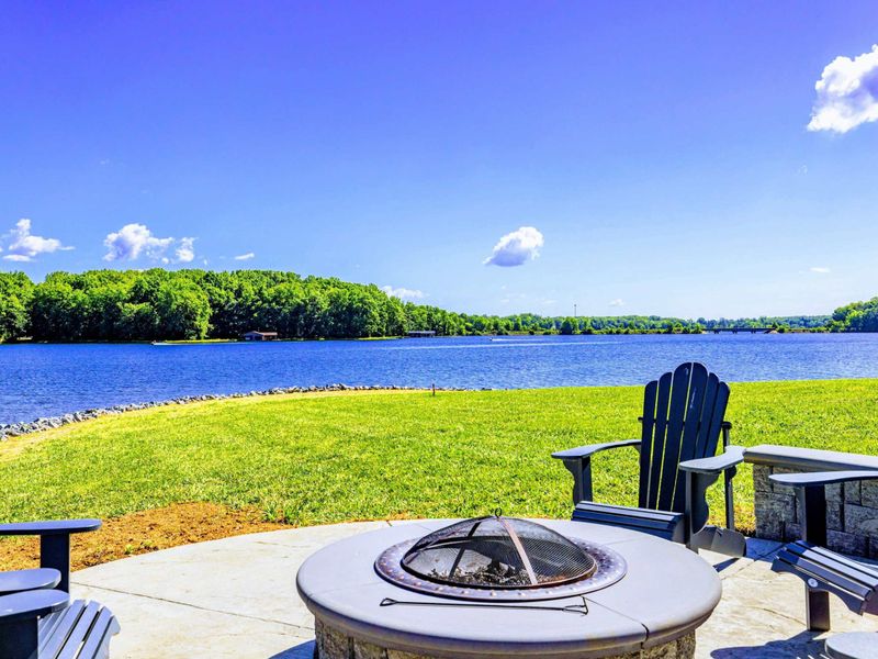 Gather around the fire pit and enjoy the stunning lake views for a peaceful and relaxing experience