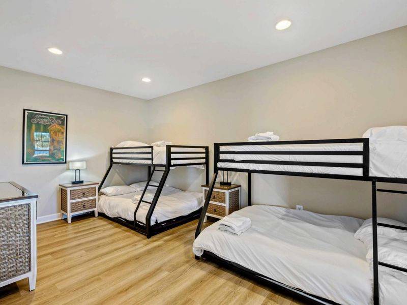 Spacious room with two bunk beds, perfect for a family stay
