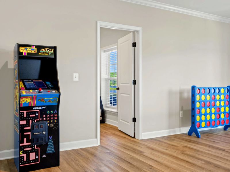 Our game room features a classic arcade machine and a large Connect Four game, providing fun for all ages.