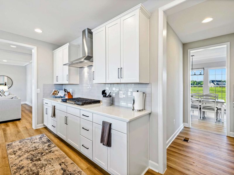 Our modern kitchen features sleek cabinetry, top-of-the-line appliances, and easy access to the dining and living areas for a seamless cooking and entertaining experience.