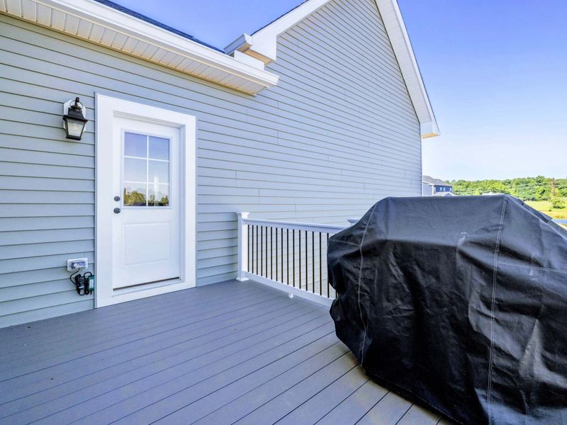 Private deck with a grill for outdoor cooking and entertaining