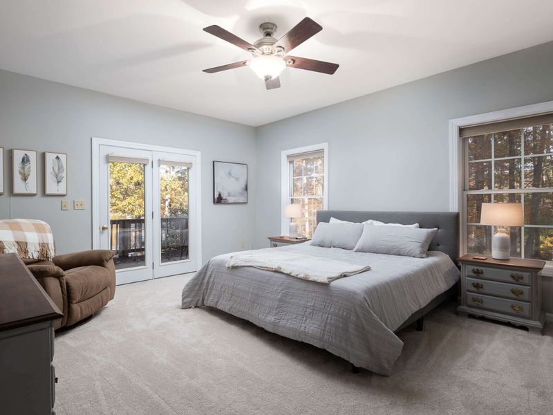 Primary bedroom on main level w/private bathroom and access to deck