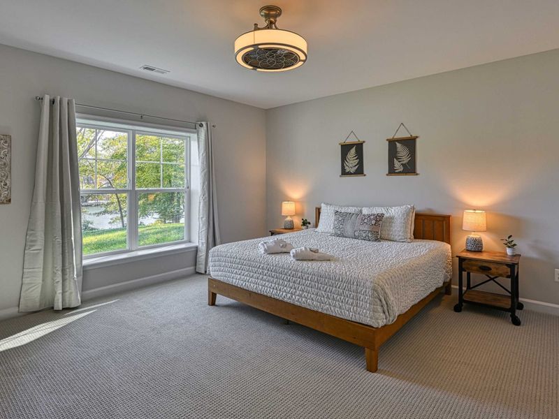Rest After the Adventure – A peaceful bedroom where the day’s lake memories settle into quiet comfort.