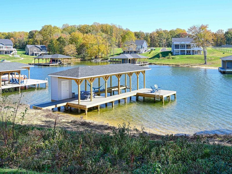 A Peaceful Cove – Calm water, open sky, and a dock made for slow afternoons by the lake.
