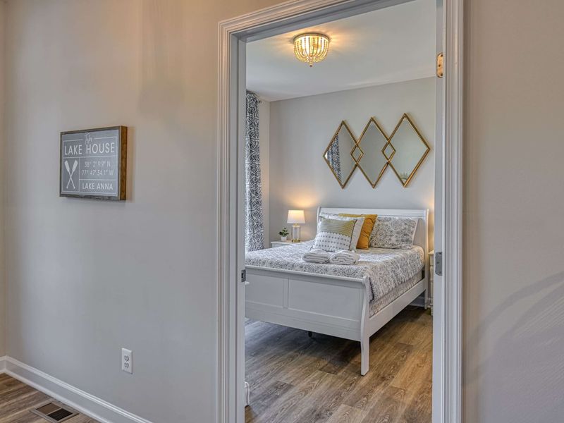 Thoughtful Lakehouse Living – A beautifully styled guest room that feels polished yet relaxed.