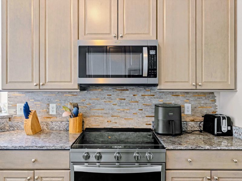 Kitchen - Coffee bar with ice maker, blender, drip coffee maker, and Keurig keeps everyone caffeinated.