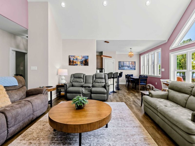 Living Room - Stretched sightlines from the great room through the kitchen and dining area keep everyone connected.