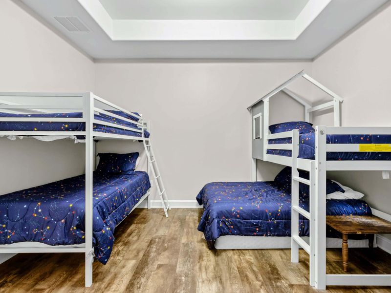 Bunk Room - Twin-over-twin bunks and a house-frame loft bunk give the kids their own dedicated room.