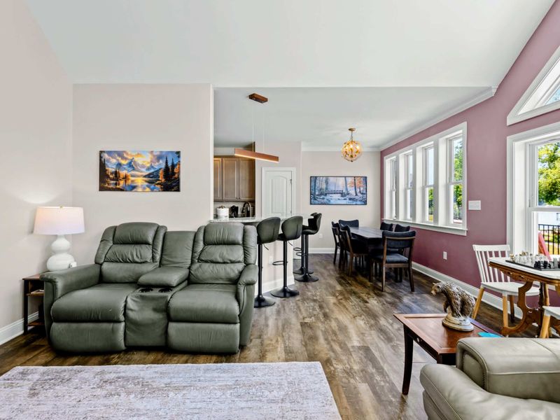 Living Room - Sectional seating opens onto the kitchen bar and dining area for easy conversation across the rooms.
