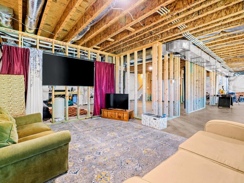 Lower Level - Big-screen TV setup with a roomy seating area, perfect for kids when the weather turns.