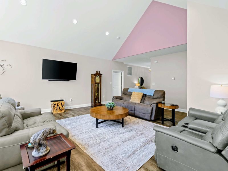 Living Room - Plenty of reclining seating spreads out under the vaulted ceiling, room enough for the whole group to find their spot.
