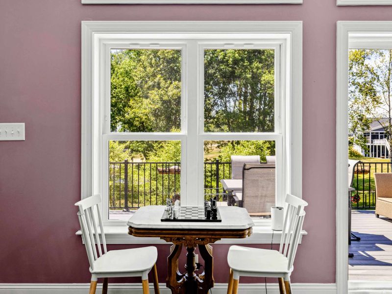 Dining Area - A vintage chess table tucked by the windows offers a quiet spot for a round of chess while the kids run around.