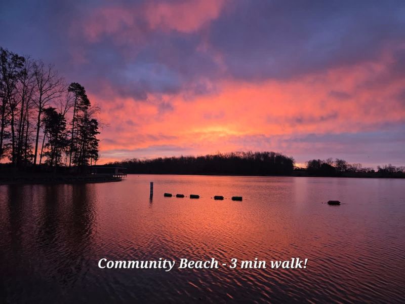 Community Beach - A short walk away, the sandy community beach lights up at sunrise over Lake Anna.